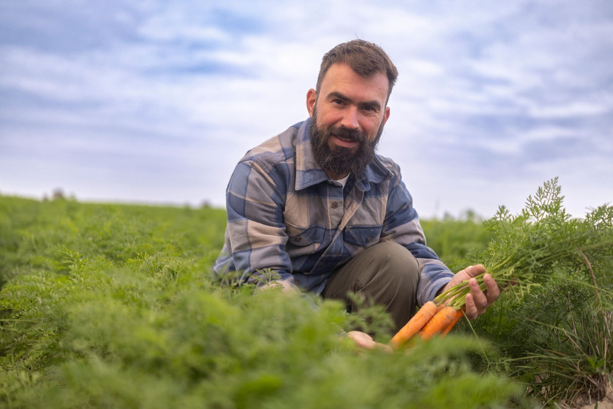 Grower inspecting crops in the field