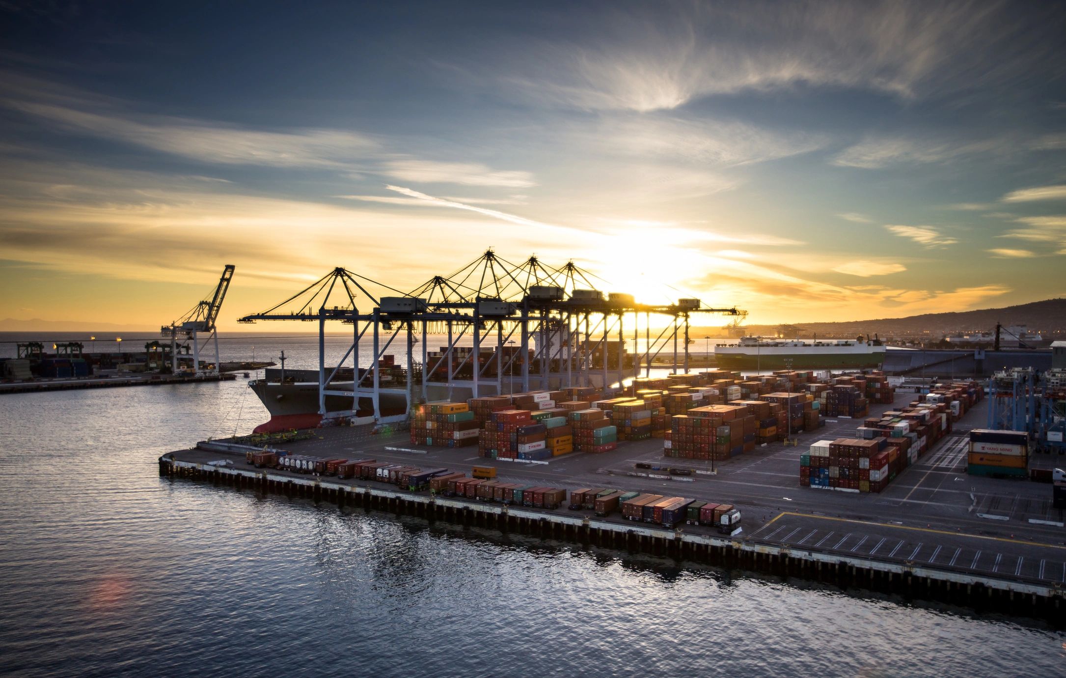 Container port at sunset, representing international logistics and distribution